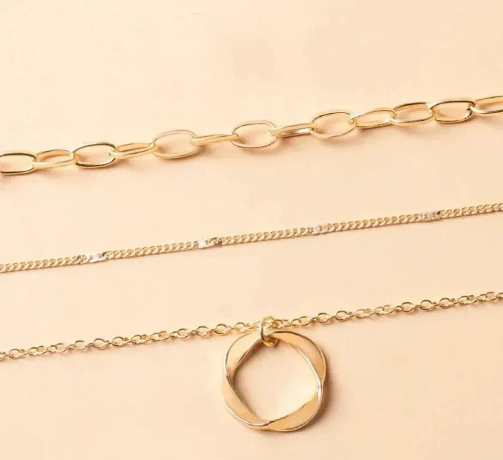 Multi-Layer Statement Necklace with Filigree Ring and Link Chain Pendants
