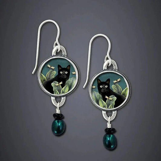 Earrings with a mystical black cat and dragonfly motif
